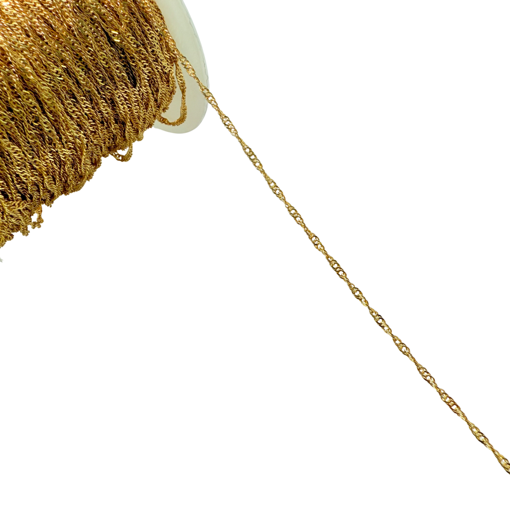 Gold chain spool on a white background